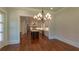 Open floor plan leads to spacious kitchen with island and stainless appliances at 10765 Shallowford Rd, Roswell, GA 30075