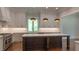 Gourmet kitchen with an island, stainless steel appliances, and custom cabinetry at 10765 Shallowford Rd, Roswell, GA 30075