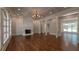 Bright living room with fireplace, hardwood floors, and coffered ceiling at 10765 Shallowford Rd, Roswell, GA 30075