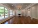 Bright living room with fireplace and hardwood floors at 10765 Shallowford Rd, Roswell, GA 30075