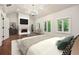 Spacious main bedroom with a fireplace and access to balcony at 10765 Shallowford Rd, Roswell, GA 30075