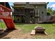 Spacious backyard with playset, trampoline and firepit is perfect for Gathering fun at 1120 Bentwater Dr, Acworth, GA 30101