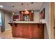 Stylish bar area featuring a wood counter, display shelving, and pendant lighting at 1120 Bentwater Dr, Acworth, GA 30101