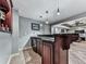 Elegant bar with granite countertops, wood cabinetry, and modern pendant lighting fixtures at 1120 Bentwater Dr, Acworth, GA 30101