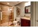 Elegant bathroom featuring a tiled shower, granite countertops, and modern fixtures at 1120 Bentwater Dr, Acworth, GA 30101