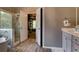 Bathroom with glass shower, garden tub, stylish vanity and access to the walk-in closet at 1120 Bentwater Dr, Acworth, GA 30101
