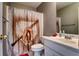Bathroom featuring a baseball themed shower curtain and vanity with sink and countertop space at 1120 Bentwater Dr, Acworth, GA 30101