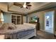 Bedroom with tray ceiling, TV on dresser, and adjacent rooms offering an inviting feel at 1120 Bentwater Dr, Acworth, GA 30101