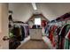 Spacious walk-in closet featuring ample shelving and hanging space for all your storage needs at 1120 Bentwater Dr, Acworth, GA 30101
