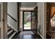 Open entryway showcasing hardwood floors, staircase, and view to the front yard at 1120 Bentwater Dr, Acworth, GA 30101
