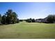 Scenic view of the golf course with lush green grass and mature trees at 1120 Bentwater Dr, Acworth, GA 30101