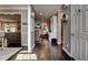 Hallway view featuring hardwood floors, neutral walls, and an open view into the living room at 1120 Bentwater Dr, Acworth, GA 30101