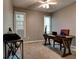 Versatile home office with a wooden desk, natural light, and ample space for work and productivity at 1120 Bentwater Dr, Acworth, GA 30101