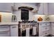 Modern kitchen boasts stainless steel appliances, a chef-style gas range, and white subway tile backsplash at 1120 Bentwater Dr, Acworth, GA 30101