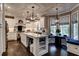 Modern kitchen with white cabinets, island with seating, and a breakfast nook at 1120 Bentwater Dr, Acworth, GA 30101