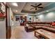 Inviting living room featuring recessed lighting, a ceiling fan, and a convenient wet bar for entertaining at 1120 Bentwater Dr, Acworth, GA 30101