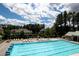 Community pool area features lounge chairs, umbrellas, and a refreshing swimming pool at 1120 Bentwater Dr, Acworth, GA 30101