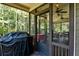 Inviting screened porch with ceiling fans and plenty of space for grilling and relaxing at 1120 Bentwater Dr, Acworth, GA 30101