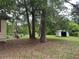 Exterior view of the backyard with trees and a storage shed at 1253 Todiway Ct, Jonesboro, GA 30238