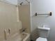 Compact bathroom with a shower-tub combo, essential fixtures, and clean, white walls at 1253 Todiway Ct, Jonesboro, GA 30238