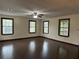 Large bedroom with hardwood flooring, neutral walls, a ceiling fan and abundant natural light at 1253 Todiway Ct, Jonesboro, GA 30238