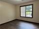 Cozy bedroom featuring durable vinyl flooring, a window providing natural light, and clean walls at 1253 Todiway Ct, Jonesboro, GA 30238