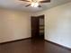 This bedroom features hard floors, neutral walls, and a closet with shelves at 1253 Todiway Ct, Jonesboro, GA 30238