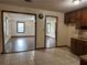 Open concept kitchen showcasing tiled floor, and seamless flow into the adjacent living spaces at 1253 Todiway Ct, Jonesboro, GA 30238