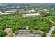 Community aerial view marked by a white teardrop, near green spaces, industrial buildings, and roadways at 4216 Stillwater Dr, Duluth, GA 30096