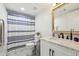 This bathroom features a new shower curtain, modern fixtures and ample storage at 4216 Stillwater Dr, Duluth, GA 30096