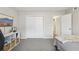 Neutral bedroom features a closet, shelving and a television for a comfortable and relaxing space at 4216 Stillwater Dr, Duluth, GA 30096