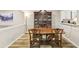 Elegant dining room with a classic hutch, wooden table, and updated flooring at 4216 Stillwater Dr, Duluth, GA 30096