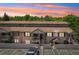 Charming condominium complex featuring covered entryways, balconies, and a beautiful sky at 4216 Stillwater Dr, Duluth, GA 30096