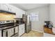 Kitchen features stainless steel appliances, white cabinets, and a window with lots of light at 4216 Stillwater Dr, Duluth, GA 30096