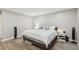 Stylish main bedroom offers neutral decor and hardwood floors at 4216 Stillwater Dr, Duluth, GA 30096