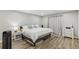 Relaxing main bedroom with wood floors, neutral decor, and lots of natural light at 4216 Stillwater Dr, Duluth, GA 30096