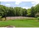 Enjoy a game of tennis on the community court surrounded by mature trees and green space at 4216 Stillwater Dr, Duluth, GA 30096