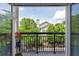 Balcony view featuring lush greenery, blue skies and a cozy outdoor space at 4252 River Green Dr # 501, Atlanta, GA 30327