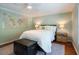 Comfortable bedroom showcasing a world map, hardwood floors, and classic decor at 4252 River Green Dr # 501, Atlanta, GA 30327
