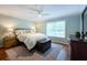 Bright bedroom featuring hardwood floors, large window, and stylish furnishings at 4252 River Green Dr # 501, Atlanta, GA 30327