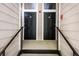 Shared entry of home with black doors and black metal railings at 4252 River Green Dr # 501, Atlanta, GA 30327