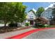 Exterior clubhouse with mature landscaping at 4252 River Green Dr # 501, Atlanta, GA 30327