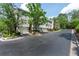 View of a modern townhome complex with well-maintained landscaping and private garages at 4252 River Green Dr # 501, Atlanta, GA 30327