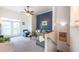 Inviting living room with a blue accent wall, balcony, and open staircase at 4252 River Green Dr # 501, Atlanta, GA 30327