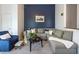 Bright living room with tall ceilings, balcony access, and a comfortable sectional sofa at 4252 River Green Dr # 501, Atlanta, GA 30327