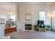 Cozy living room features a marble fireplace, ample natural light, and neutral carpet at 4252 River Green Dr # 501, Atlanta, GA 30327