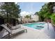 Community pool with chairs and tables at 4252 River Green Dr # 501, Atlanta, GA 30327