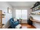 Sitting room features a comfortable chair, hardwood floors and natural light at 4252 River Green Dr # 501, Atlanta, GA 30327