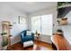 Sitting room features a comfortable chair, hardwood floors and natural light at 4252 River Green Dr # 501, Atlanta, GA 30327