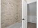 Bathroom with white subway tile shower and tub combination, offering a clean and classic style at 710 Crab Orchard Ct, Roswell, GA 30076